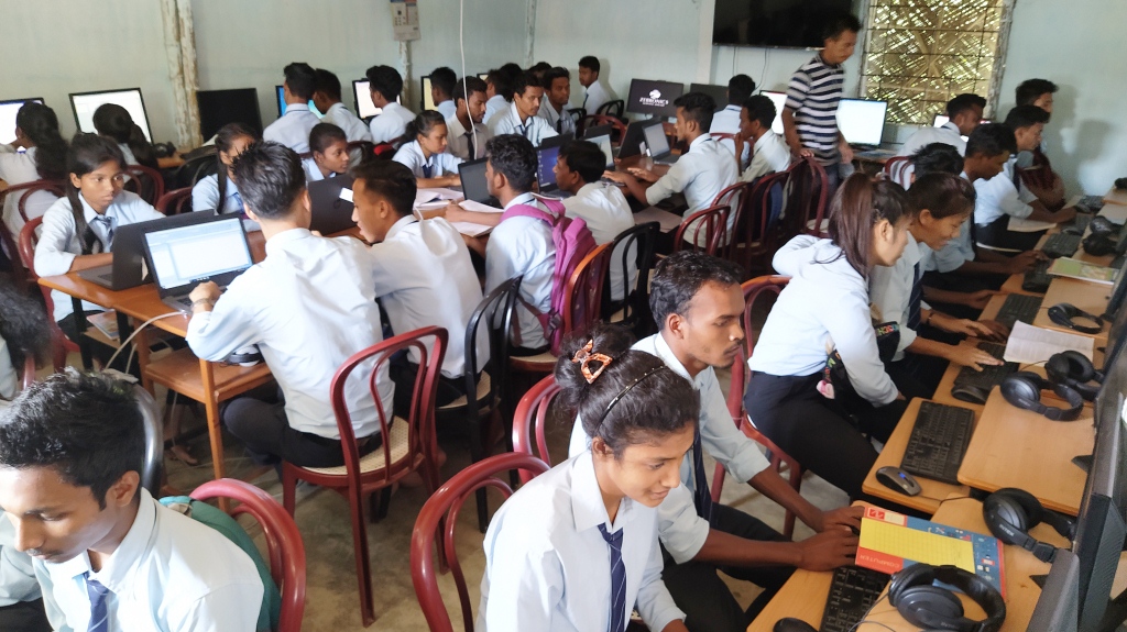 Students  using the copmuter laboratory for a project in  Don Bosco College Golaghat Assam,India