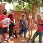 Volunteers from the Don Bosco Oratory and Unisalesiano University  delivering food baskets and an image of our Lady Aparecida to 50 needy families in the Água Branca