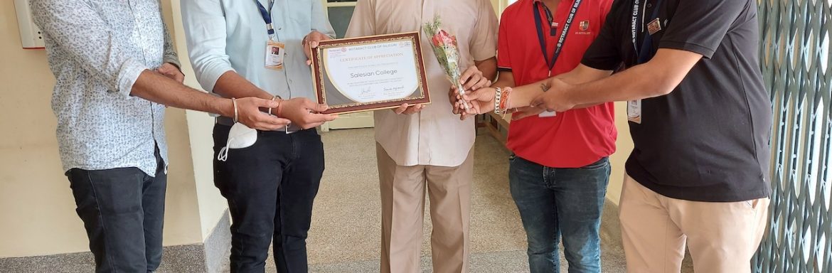 Salesian College Principal Father George Thadathil receives the honor certificate from Rotaract Club of Siliguri in appreciation of the college's outstanding commitment and valued contribution towards the nation.